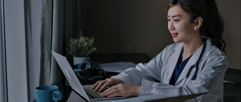 Healthcare provider using laptop